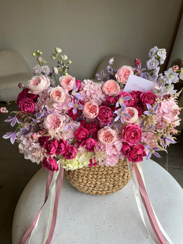 Flower arrangement in a basket by O'Hara Florist