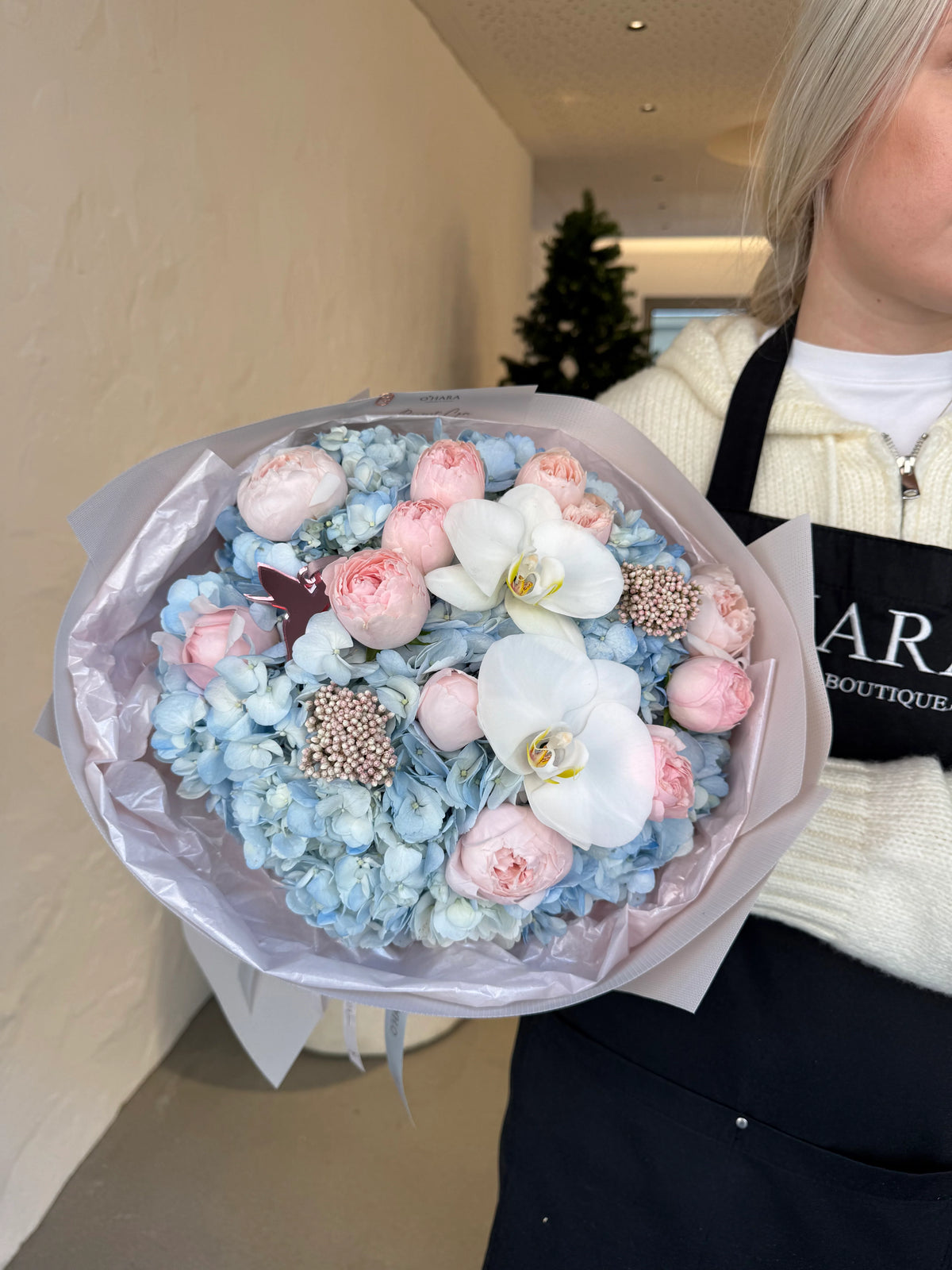 Blue hydrangea and white orchid bouquet at the O'Hara Florist studio in West LAhero_slide