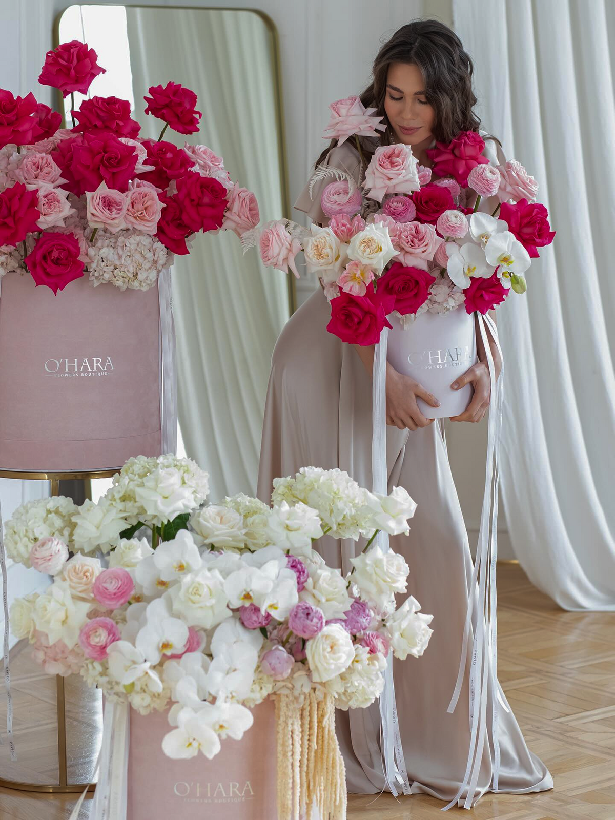 Red and pink rose box and white orchid arrangement by O'Hara Floristhero_slide