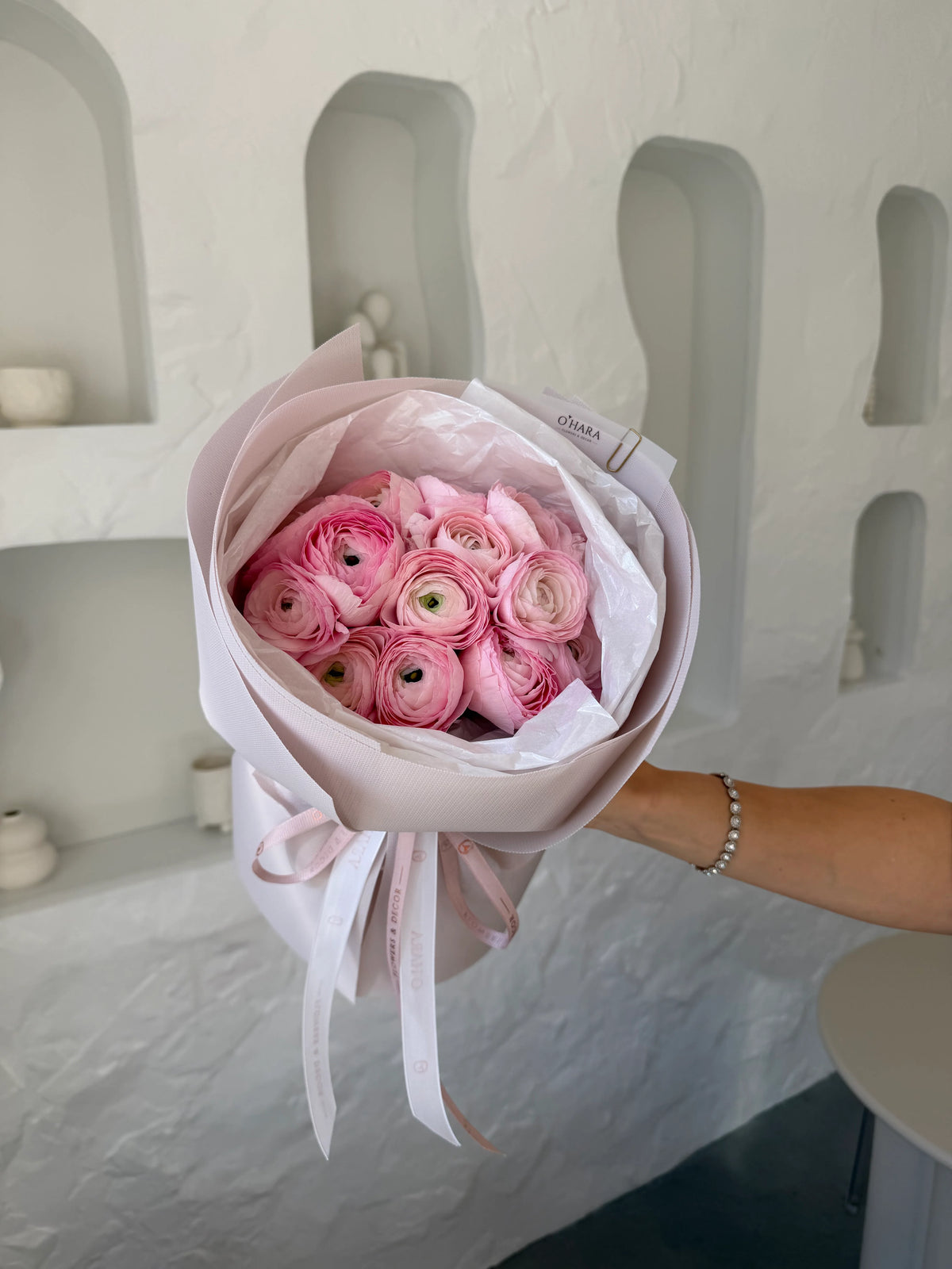 Hot pink ranunculus bouquet by O'Hara Florist